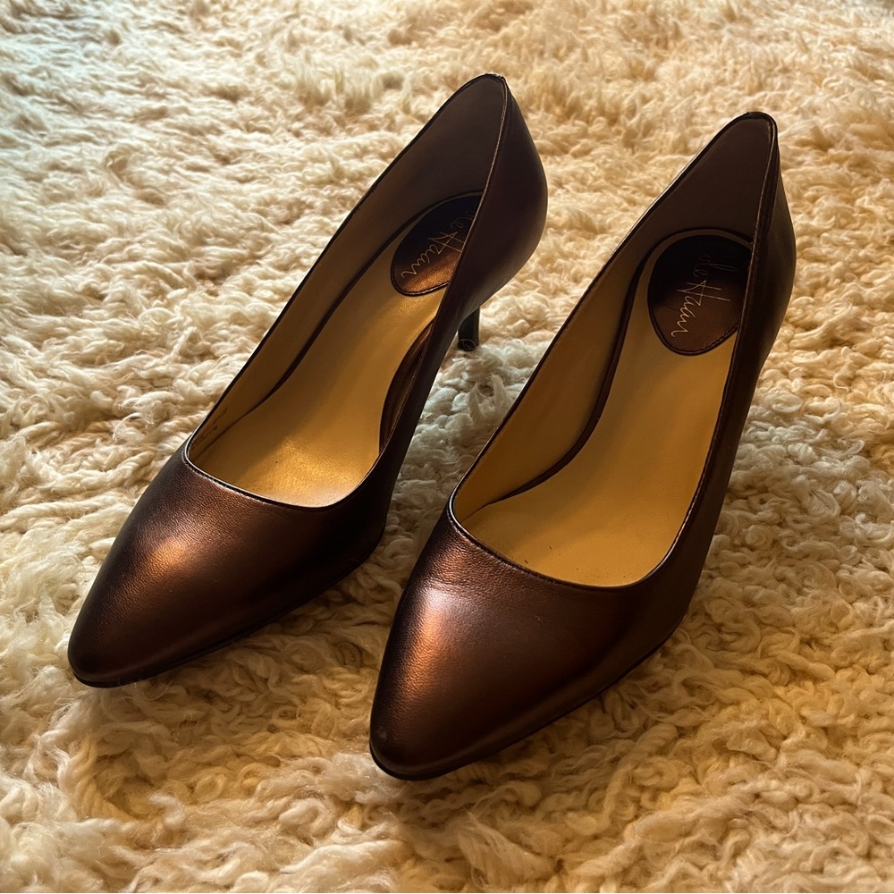 Elegant Cole Haan pumps in rich bronze.